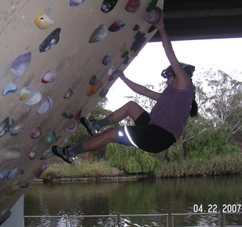 [climbing wall under bridge]