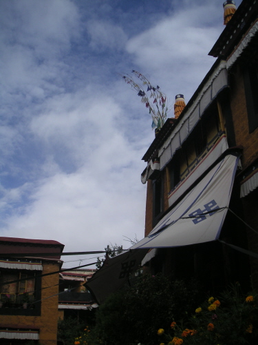 [clouds over prayer flags]